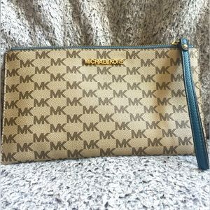 MK Michael Kors monogram wristlet in excellent condition